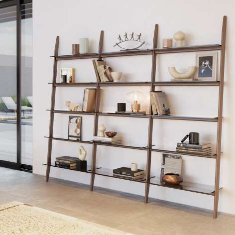 Stiletto leaning ladder shelf system by BDI with walnut frame and glass shelves