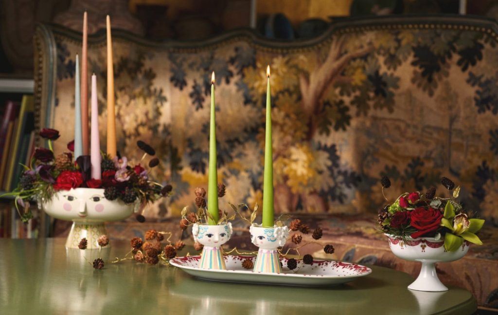 Eva candleholders and bowl decorated with candles and foliage