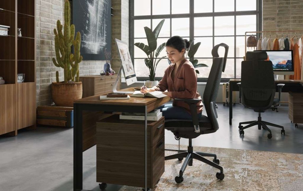 Woman sitting in BDI Coda office chair